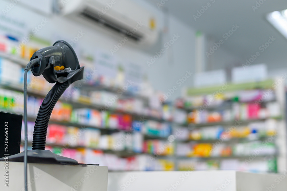 Background of scanning barcode on a medicine box in a modern pharmacy drugstore.
