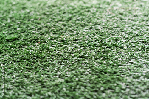 Artificial green grass texture background for soccer field, golf course, lawn background, children playground, outdoor field