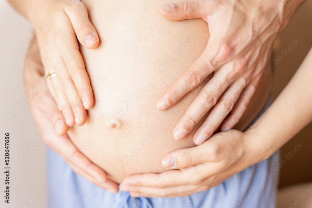 Belly hands pregnant woman. Happy pregnancy woman and husband hugging pregnant belly. Concept of pregnancy, maternity, expectation for baby birth. Belly hands pregnant woman. Happy pregnancy woman and husband hugging pregnant belly. Concept of pregnancy, maternity, expectation for baby birth.