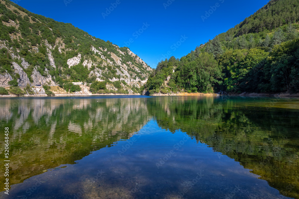 San Domenico lake, Abruzzo - Italy. Small lake surrounded by mountains and rocky spurs, in the green heart of an almost uncontaminated nature. 