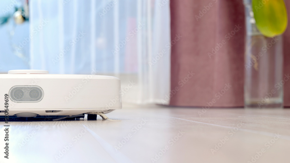 Robot wireless vacuum cleaner working on the floor Robot wireless vacuum cleaner working on the floor
