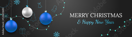 Merry Christmas and Happy New Year vector banner. Realistic rose silver and blue baubles, snowflakes hanging on dark background with realistic garland. Background with gold Christmas icon