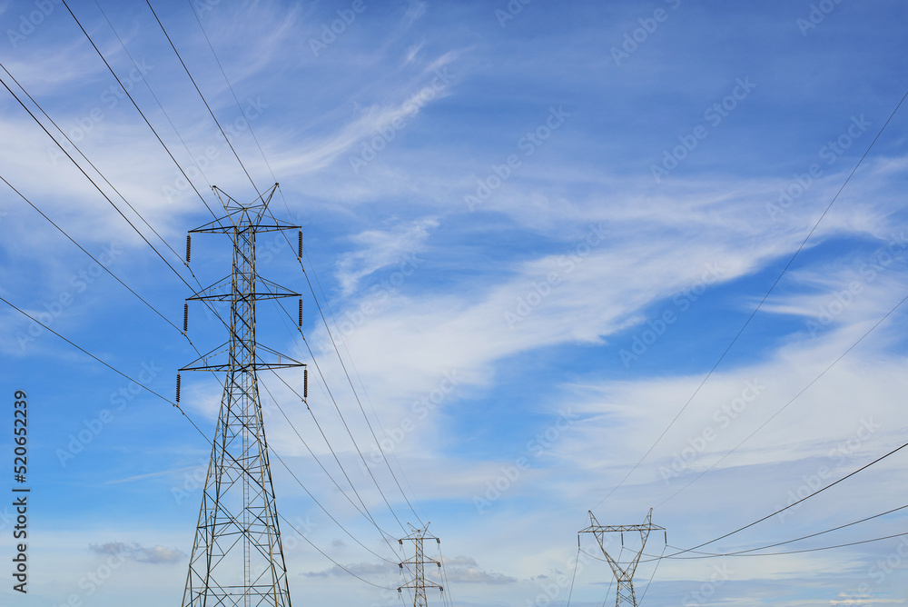 High Voltage Power Transmission Tower And Sky Background Stock Photo