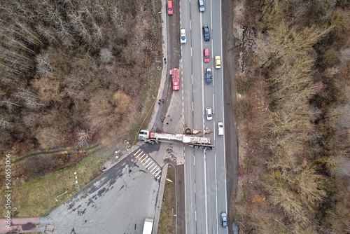 Φωτογραφία Aerial view of road accident with overturned truck blocking traffic