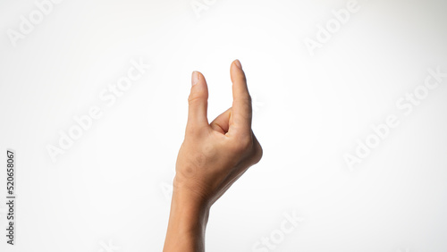 Women's fingers show a small distance on a white background