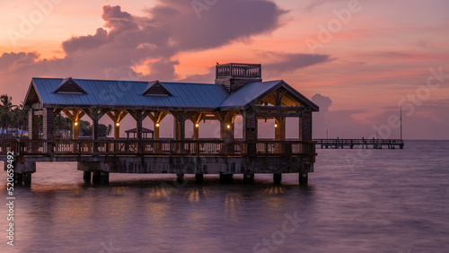 Pier at the beach in Key West, Florida USA with powerful and beautiful sky
