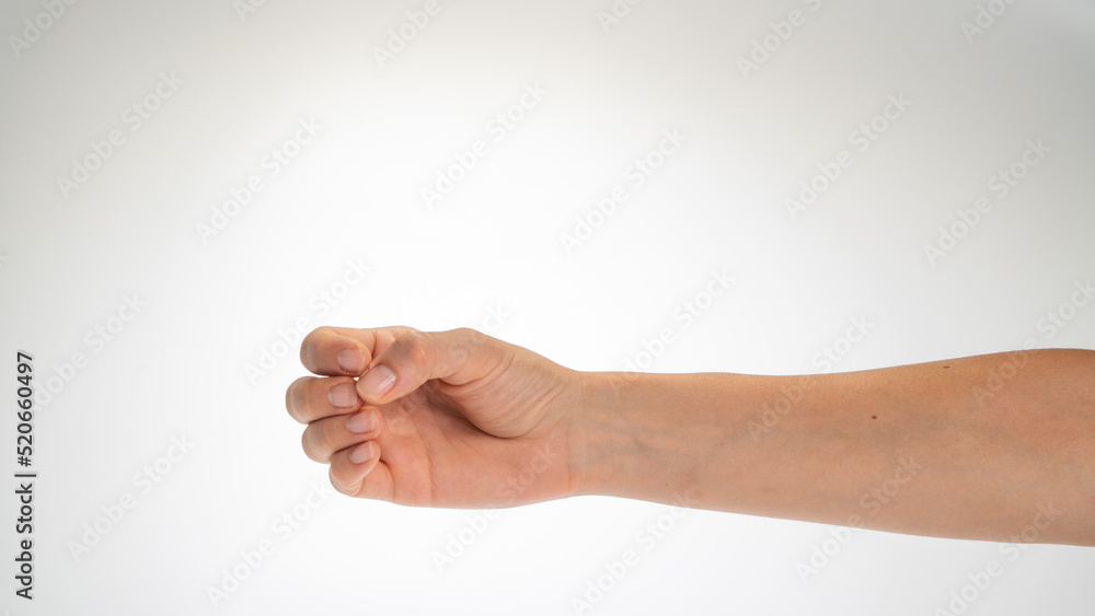 Hand woman gesture fingers clenched into a ring holding a cylindrical object Hand woman gesture fingers clenched into a ring holding a cylindrical object