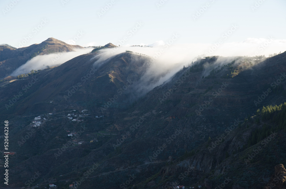 Clouds entering from the north side of the Tejeda volcanic crater. The Nublo Rural Park. Tejeda. Gran Canaria. Canary Islands. Spain.
