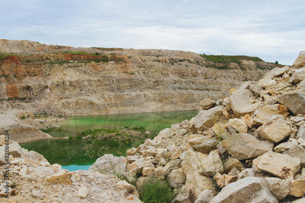 Lake formation in an old abandoned quarry. Termination of mining operations.