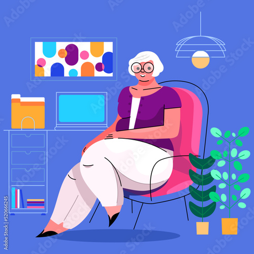 Femme âgée assise à son bureau de travail, consultante psychologue gériatre professeur conseillère,expérience sénior, cours d'informatique,retraite active, personne souriante,télétravail distance photo