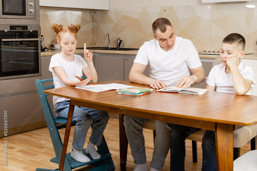 distance learning, daughter learns lessons in the kitchen the whole family helps her distance learning, daughter learns lessons in the kitchen the whole family helps her