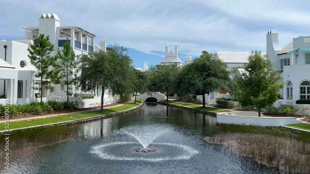 A walking path with water feature and homes in Alys Beach, Florida. A walking path with water feature and homes in Alys Beach, Florida.