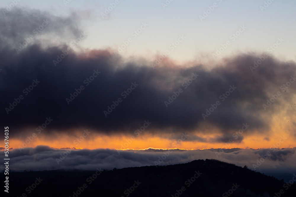 sunset in the mountains with a sea of fog