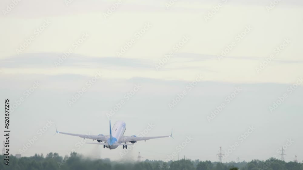 Rear view of jet airplane departure at Novosibirsk airport. Tourism and travel concept Rear view of jet airplane departure at Novosibirsk airport. Tourism and travel concept