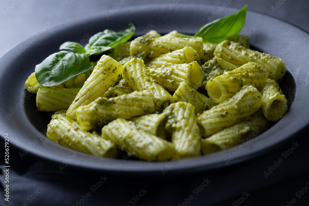 Pasta pesto and pea sauce served in bowl Pasta pesto and pea sauce served in bowl