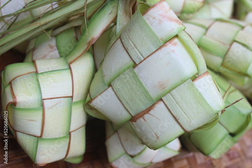 Ketupat is a traditional Indonesian food wrapped in coconut leaves, usually served during Eid al-Fitr photo