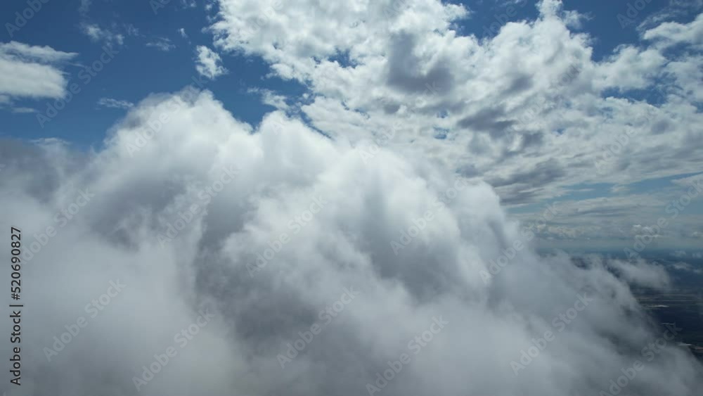 The view from the cockpit, flight among the clouds, blue sky, huge soft clouds. The view from the cockpit, flight among the clouds, blue sky, huge soft clouds.