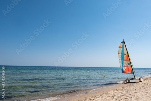 Sailboat isolated on the beach, relaxing holiday in Tunisia. 