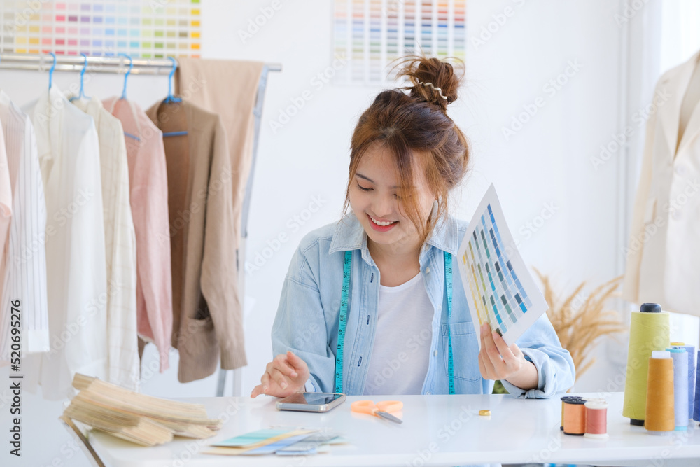 Fashion designer working in studio Fashion designer working in studio