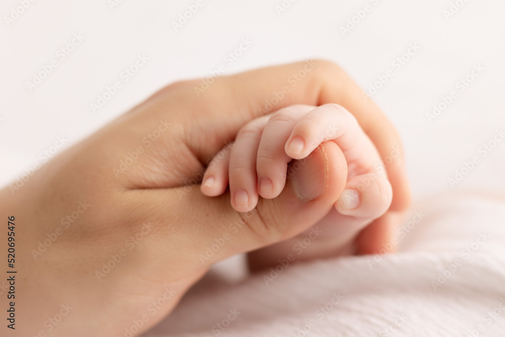 father hand holding baby`s hand father hand holding baby`s hand