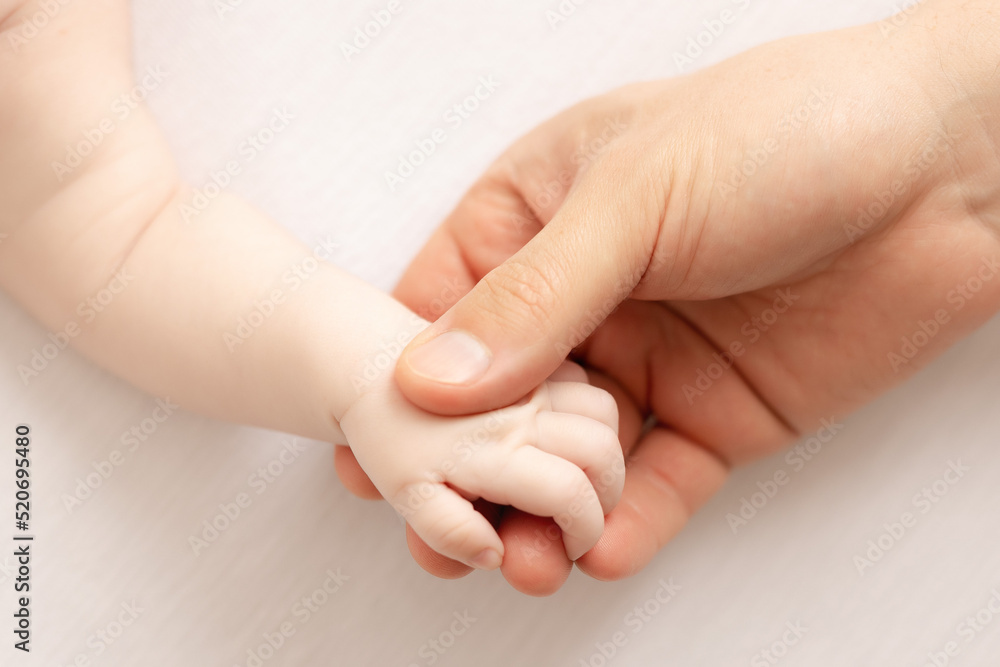 father hand holding baby`s hand father hand holding baby`s hand