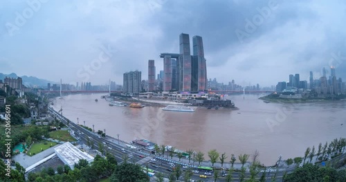 time lapse video of Chongqing cityscape in nightfall, dusk to night scene of two rivers in Chaotianmen, China. (fisheye lens shooting) photo
