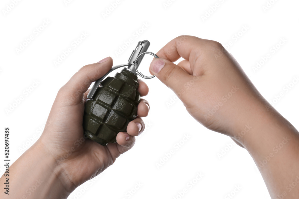 Fototapeta premium Man pulling safety pin out of hand grenade on white background, closeup