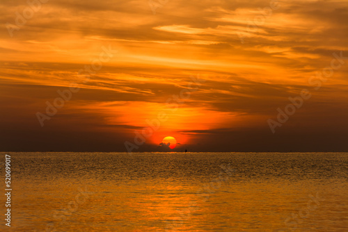 sunset sky with dramatic sunset clouds over the sea. Beautiful sunrise over Ocean