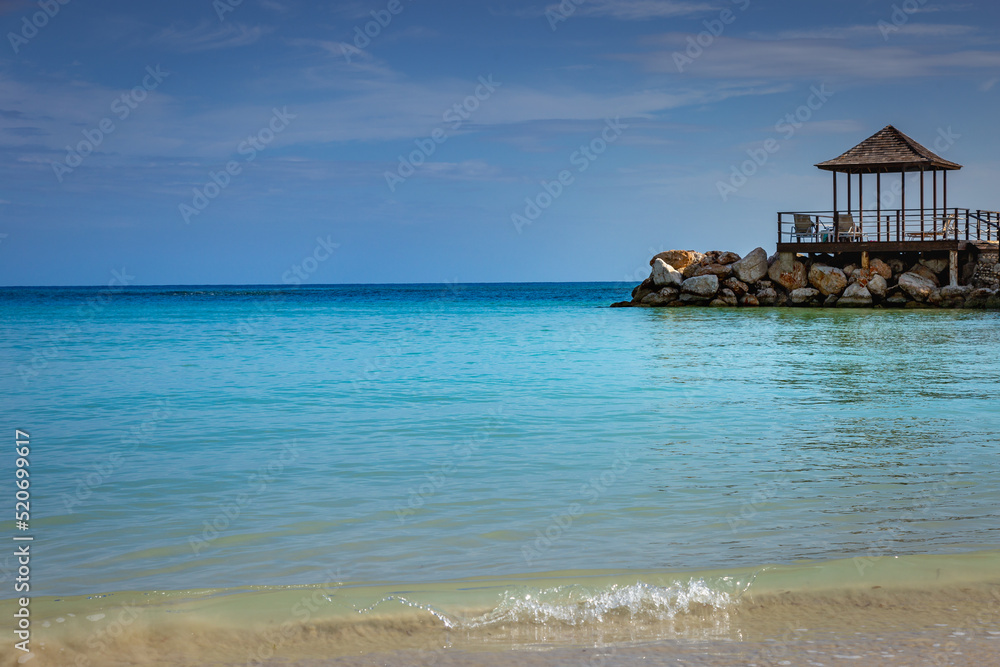 Tropical paradise: caribbean beach with pier and gazebo, Montego Bay, Jamaica Tropical paradise: caribbean beach with pier and gazebo, Montego Bay, Jamaica