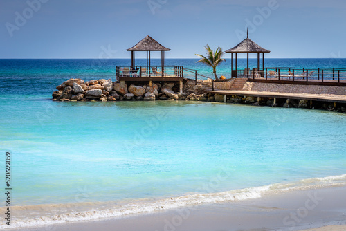 Tropical paradise  caribbean beach with pier and gazebo  Montego Bay  Jamaica