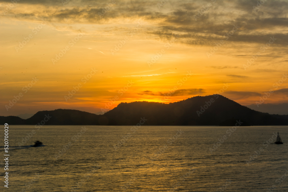 Sunset over the sea at the coast of Angra dos Reis town, State of Rio de Janeiro, Brazil. Photo taken with Nikon D7100, 18-200 lens, at 52mm, 0.4 sec f 32 ISO 100. Date: Dec 28, 2016.