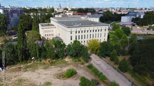 In the background Frankfurter Tor. Tranquil aerial view flight fly forward drone footage to the club Berghain Berlin Friedrichshain Summer 2022. Cinematic from above Tourist Guide by Philipp Marnitz photo