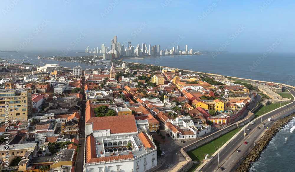 Naklejka premium Aerial drone panorama of walled cartagena historic city with skyline in background / Colombia