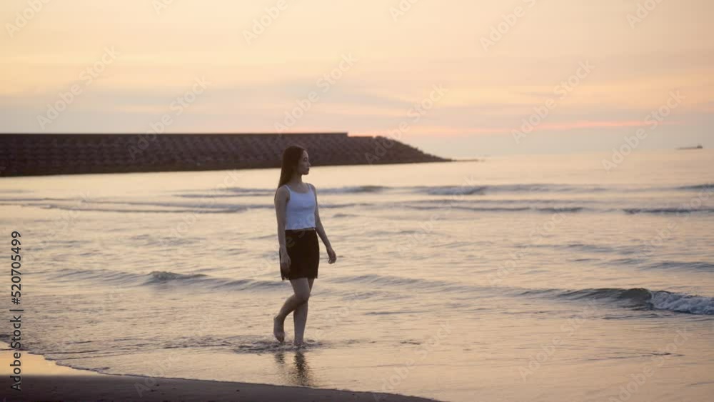 Girl Walking On The Beach Alone During Sunset Time From The Side Girl Walking On The Beach Alone During Sunset Time From The Side