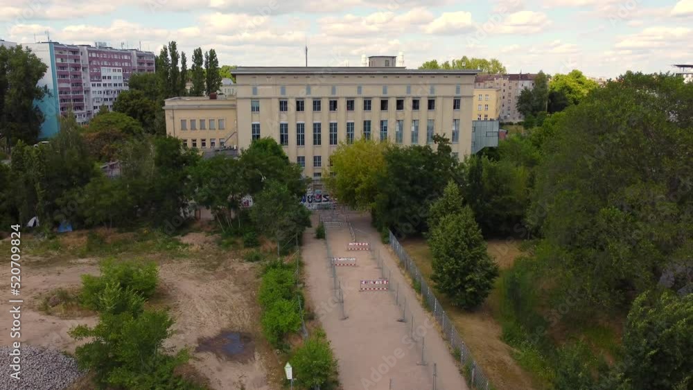 What happens in berghain stays in berghain
Dramatic aerial view flight pedestal up drone footage of techno club Berghain Berlin Friedrichshain Summer 2022. Cinematic from above by Philipp Marnitz