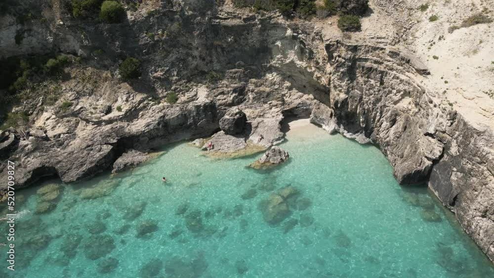 Rocky Shore Enclosed By Sea Cliffs At Xigia Sulfur Beach In Zakynthos Island, Greece. Aerial Drone Shot Rocky Shore Enclosed By Sea Cliffs At Xigia Sulfur Beach In Zakynthos Island, Greece. Aerial Drone Shot