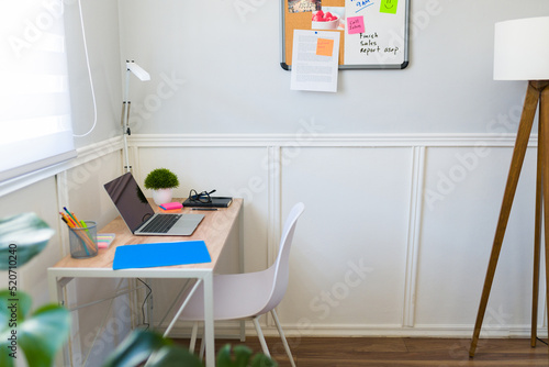White workspace with a computer and office supplies to work remotely