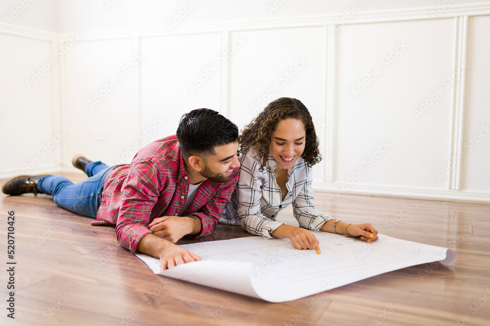 Excited woman and man dreaming about their new renovated home