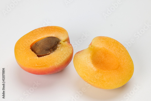 Fresh ripe juicy yellow orange red apricot fruit whole cut half slice seed on white background