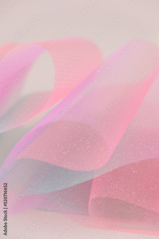 Fabric background.Wallpaper mauve phone.Tulle fabric.iridescent gradient texture.Shiny pink fabric with gradients. texture with iridescent folds. Fabric background.Wallpaper mauve phone.Tulle fabric.iridescent gradient texture.Shiny pink fabric with gradients. texture with iridescent folds.
