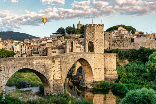Balloon trip over the medieval village of Besalú en Girona, Catalonia, Spain. Foreground of medieval bridge - Nacional park of Garrotxa photo
