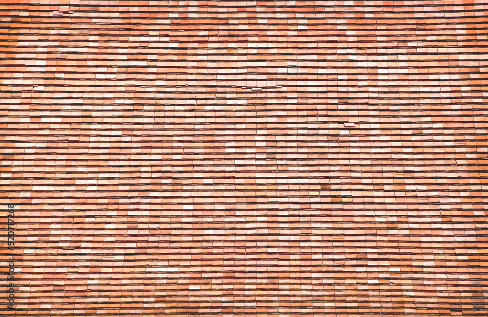 Old brown roof tile of temple background with overlap seamless patterns Old brown roof tile of temple background with overlap seamless patterns