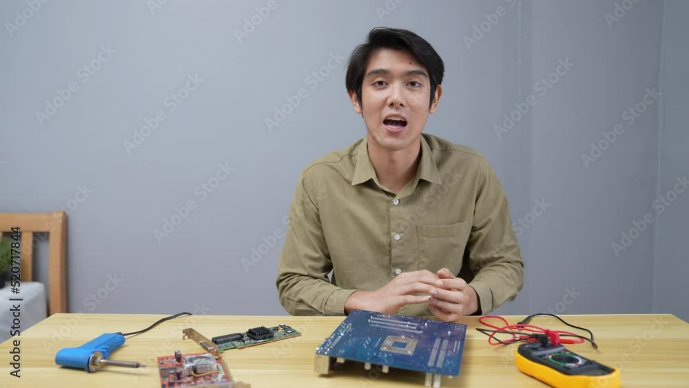 technology concept of 4k Resolution. Asian man teaching himself how to repair simple appliances by himself. computer repair. technology concept of 4k Resolution. Asian man teaching himself how to repair simple appliances by himself. computer repair.