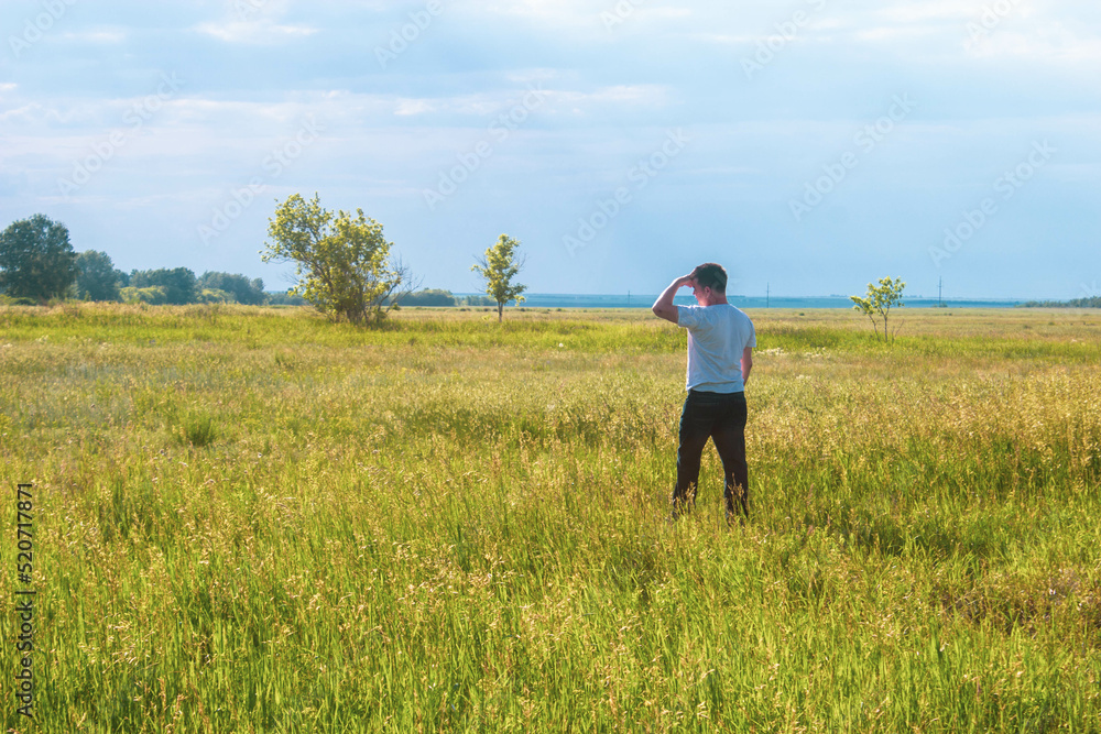 person walking in the field