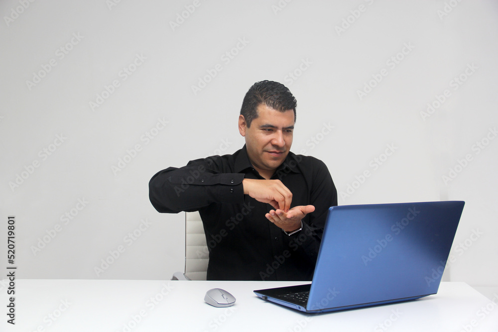 Latino adult man speaks Mexican sign language with a deaf person through a laptop in a video call
Latino adult man speaks Mexican sign language with a deaf person through a laptop in a video call