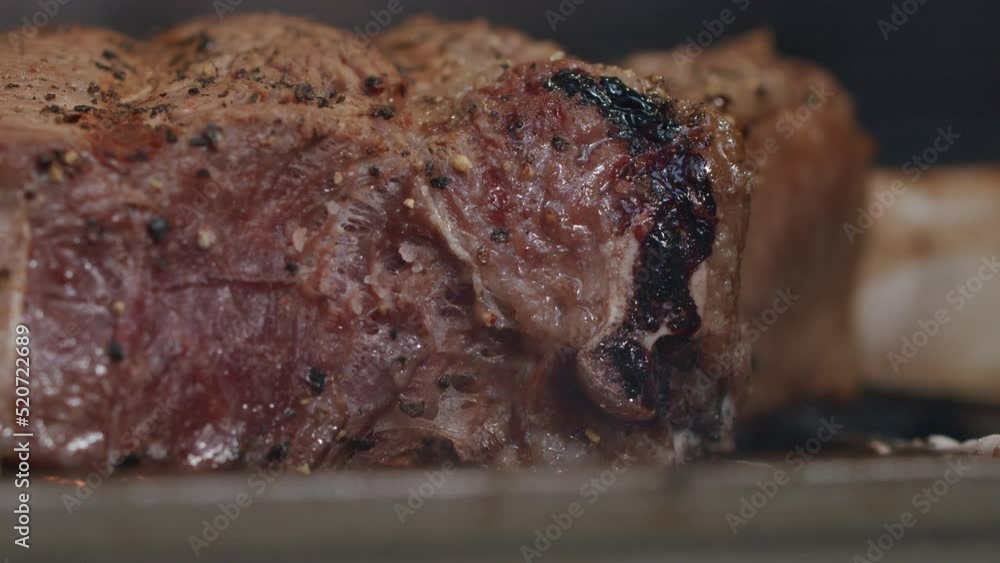 Close Up Seasoned Beef Steak Cooking In Flame Grill Barbecue In Slow Motion, 4K Close Up Seasoned Beef Steak Cooking In Flame Grill Barbecue In Slow Motion, 4K