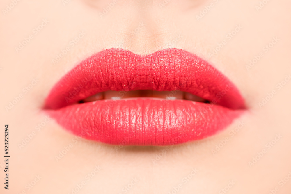 Fototapeta premium Sexy lips. Beautiful red lipstick. Sensual open mouth. Beautiful makeup close-up.