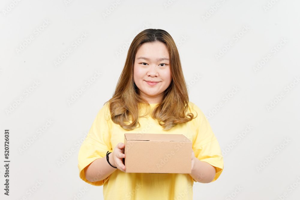 Holding Package Box or Cardboard Box of Beautiful Asian Woman wearing yellow T-Shirt Holding Package Box or Cardboard Box of Beautiful Asian Woman wearing yellow T-Shirt