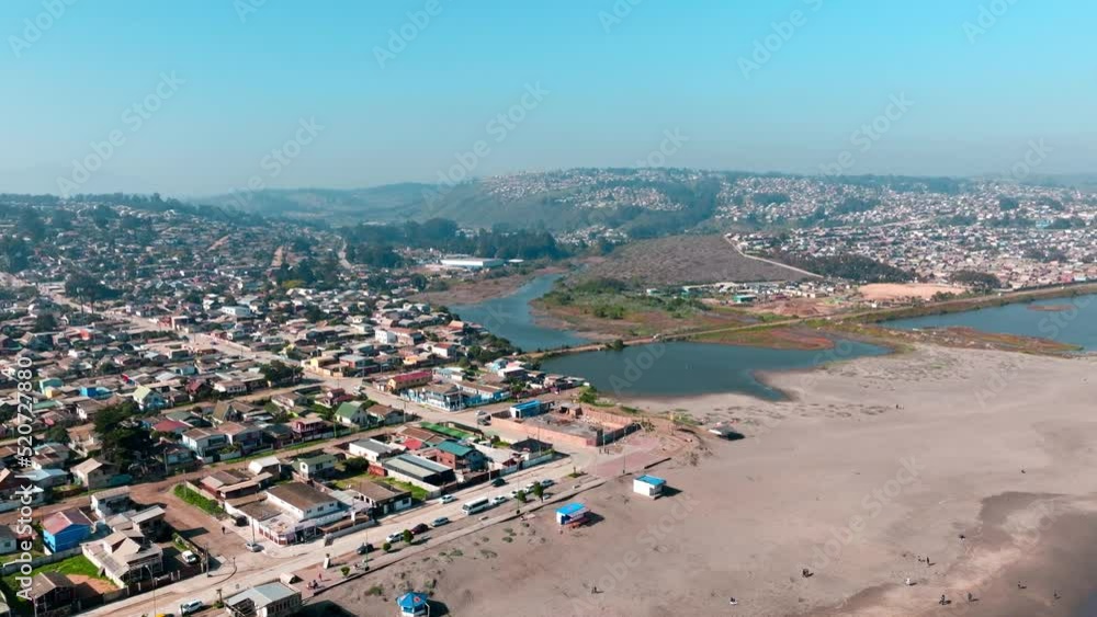 Aerial view of estuary next to the beach during sunny day in Cartagena, San Antonio province, Chile Aerial view of estuary next to the beach during sunny day in Cartagena, San Antonio province, Chile