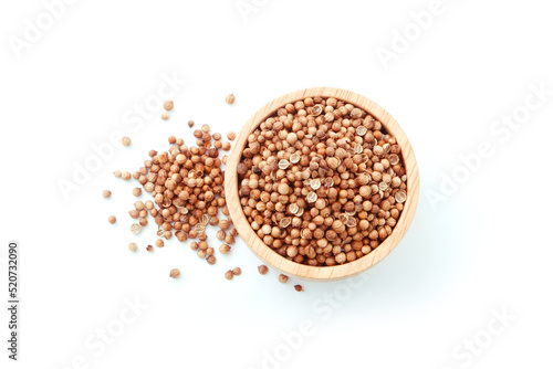 Coriander seed in wooden bowl isolated on white background , top view , flat lay.